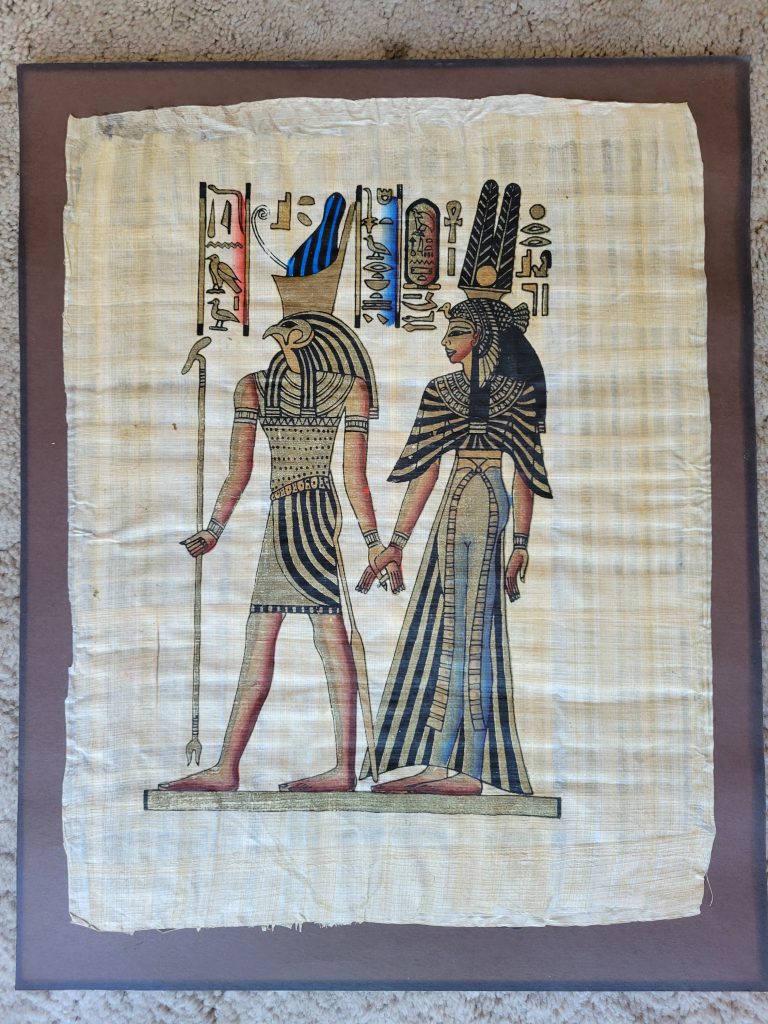 Here is a photo of the papyrus artwork just after I removed it from the frame. Notice the faded black color of the posterboard. The art was completely glued to the backing.