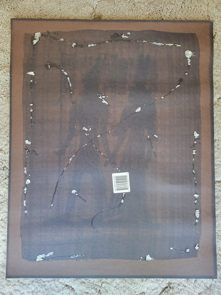 This photo speaks to several archival issues at once. First, notice the "ghost" image of the art on the posterboard. This is from UV light shining on the image and fading the posterboard behind it, but the painted portions blocked the light from shining through leaving a "ghost" image. Second, notice the overwhelming amount of glue used and how that tore at pieces of the art. And lastly, the barcode sticker was not removed when it was originally framed, which is not something you want touching your documents as it is not archival. In fact, nothing in the picture is archival.