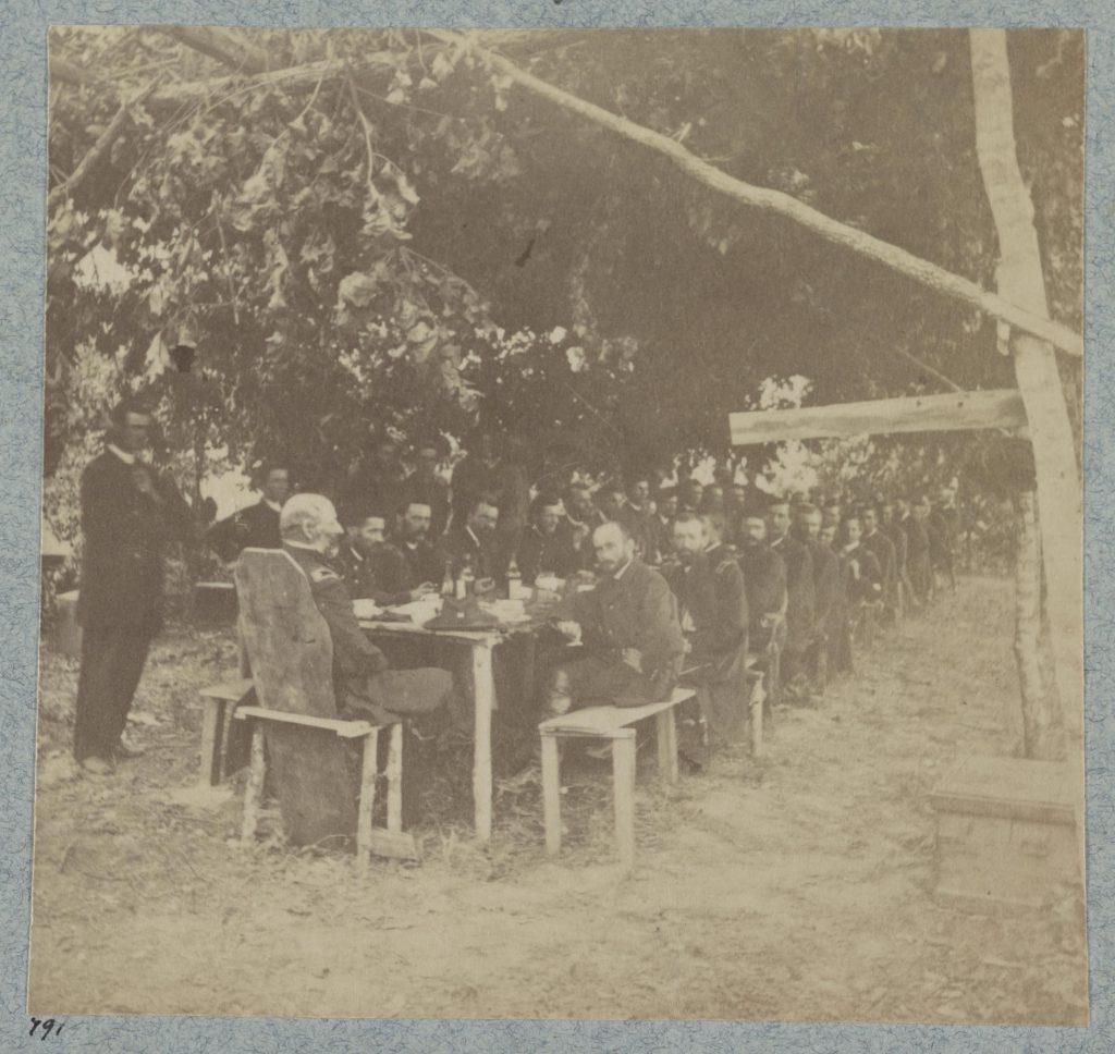 Lt. Col. Ira Spaulding and the 50th New York Engineers in front of Petersburg, Virginia celebrating the Independence Day with a hearty meal.