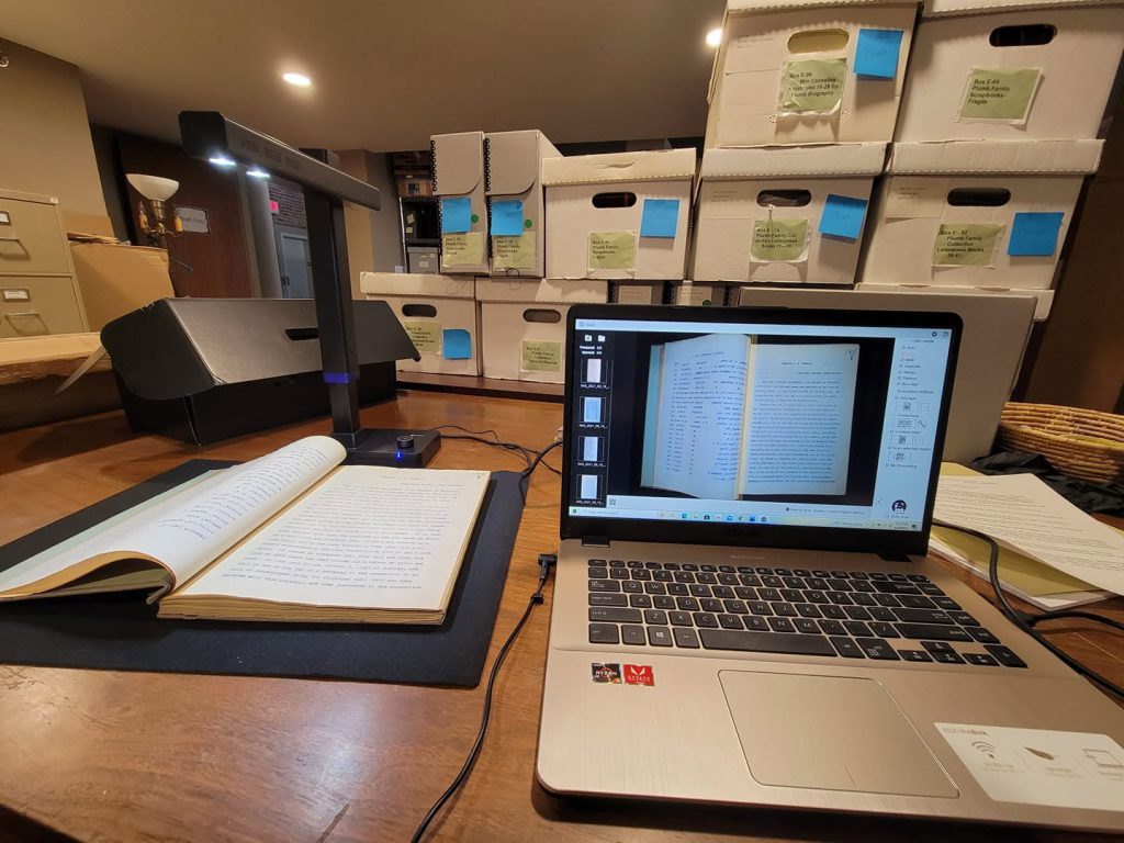 Here you can see a CZUR overhead scanner hooked up to my laptop to digitize bound volumes of archive material.